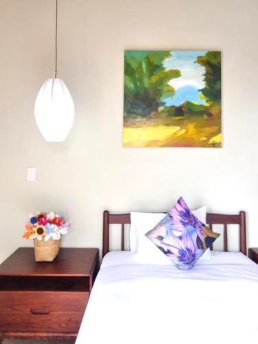 Postel nebo postele na pokoji v ubytování LuA House Hoian