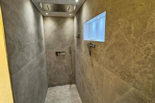 a shower stall with a window in a bathroom at Cozy & Modern Living in Central Odense in Odense
