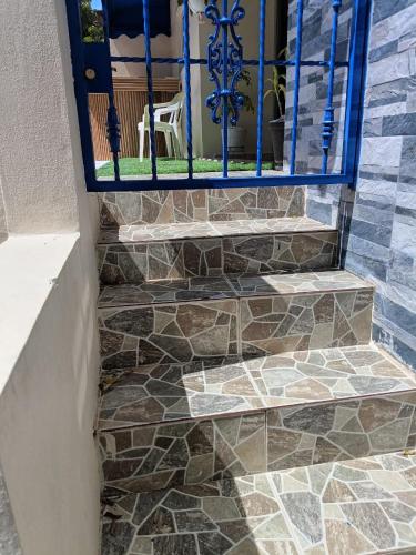 a set of stone stairs with a blue gate at Mi espacio in Colorado