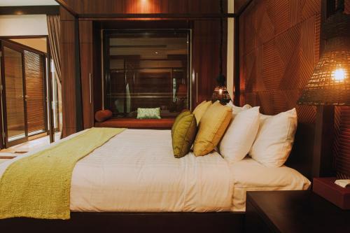 Кровать или кровати в номере Nunamkhalu Private Villa and Spa