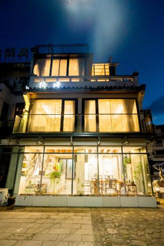 a large building with a lot of windows at The Lu Village Retreat in Guilin