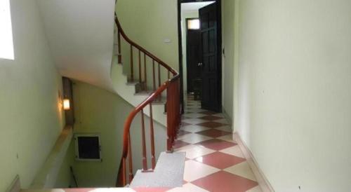 a hallway with a stairway with a stair case at Hoang Hung Hotel in Hanoi