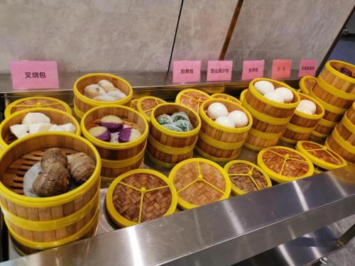 a bunch of baskets filled with different types of food at Xian Katie Eastman Hotel in Xi'an