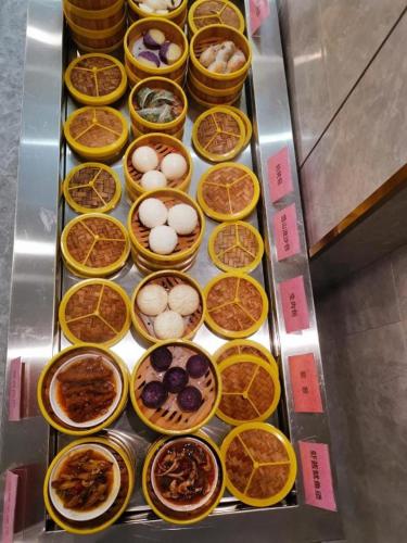 a bunch of baskets filled with different types of food at Xian Katie Eastman Hotel in Xi'an