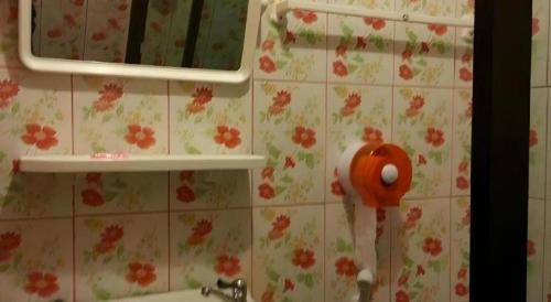 a bathroom with a mirror and a toothbrush at Tai Asean House in Udon Thani