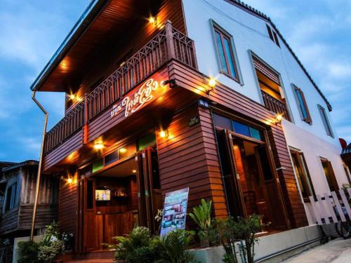 a building with a sign in front of it at Ban Glai Kong in Chiang Khan