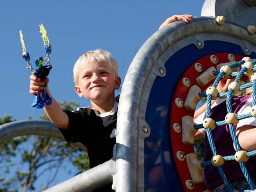 a young boy is playing on a roller coaster at 6 person holiday home in Skærbæk-By Traum in Skærbæk