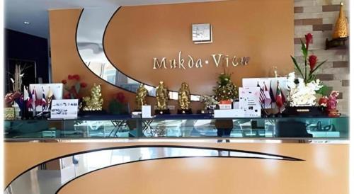 a counter in a store with christmas decorations on it at Mukdaview Hotel in Mukdahan