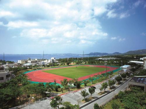 a baseball field in the middle of a city at Nature Miraikan in Naha