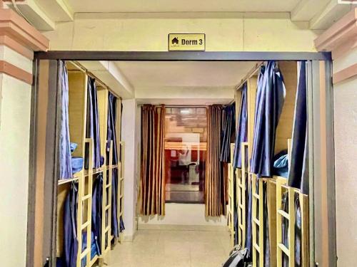 a walkway to a room with a sign that reads panic at Home 33 in Sapa