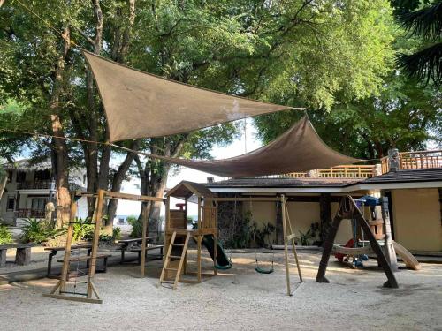a tent on top of a house with a playground at Acuaverde Beach Resort in San Juan