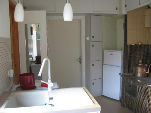 Kuchyň nebo kuchyňský kout v ubytování Soliid Apartment