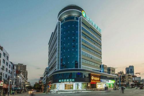 a tall building with a sign on top of it at City Comfort Inn Liuzhou Liucheng in Liuzhou