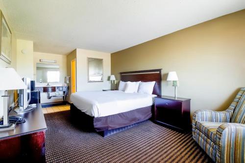 Ένα ή περισσότερα κρεβάτια σε δωμάτιο στο MHO Hotel Eloy Casa Grande Near I-10