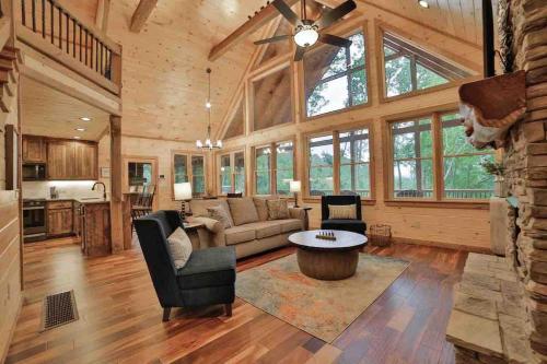 a living room with a couch and a table at Mountain Hideaway with Hot Tub & Fire Pit in Mineral Bluff