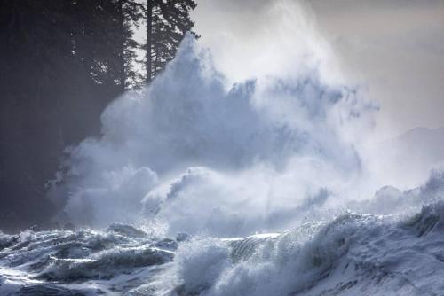 a large wave in the ocean with a spray at The Great Escape - Shirley in Sooke