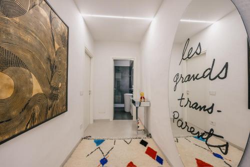 a hallway with a large painting on the wall at Palace d'Art - Centro Storico di Arezzo in Arezzo