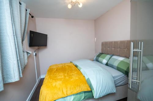 Ένα ή περισσότερα κρεβάτια σε δωμάτιο στο Absolute Tranquillity Home