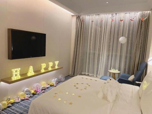 Ένα ή περισσότερα κρεβάτια σε δωμάτιο στο Onejee Hotel Shenzhen