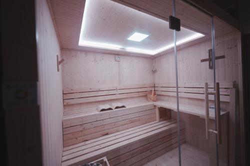 a sauna with a window and a glass door at えにしの宿 市原 一棟貸切 最大6名 BBQ ev充電可 in Ichihara