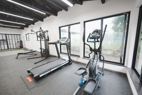 a gym with two treadmills and two ellipticals at えにしの宿 市原 一棟貸切 最大6名 BBQ ev充電可 in Ichihara