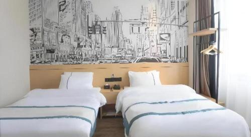 Ένα ή περισσότερα κρεβάτια σε δωμάτιο στο City Comfort Inn Jiujiang Gongqing Science and Technology College High-speed Railway Station