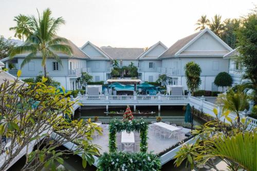 an aerial view of a house with a resort at My BanLao Hotel in Luang Prabang