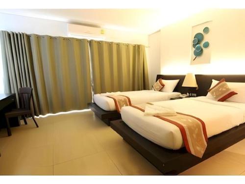 Ένα ή περισσότερα κρεβάτια σε δωμάτιο στο The O Valley Hotel