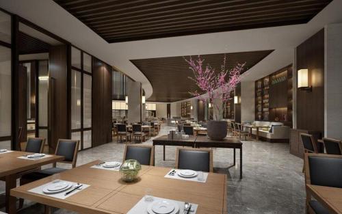 a restaurant with tables and chairs and a dining room at Rosedale Hotel Taicang in Taicang