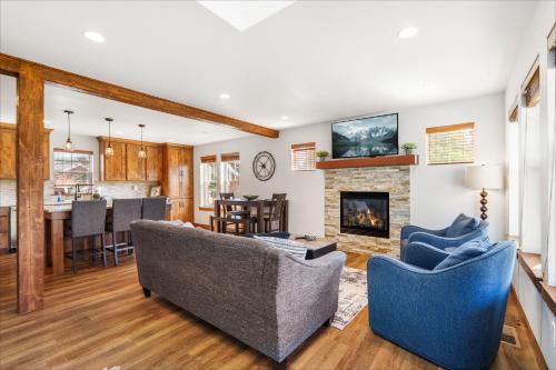 a living room with two couches and a fireplace at Sandpoint Shenanigans in Dover