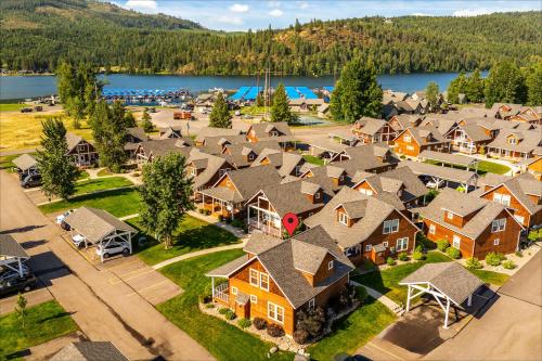 an aerial view of a village with houses and a lake at Sandpoint Shenanigans in Dover