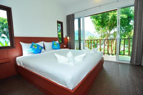 Ένα ή περισσότερα κρεβάτια σε δωμάτιο στο Sea View Bungalow