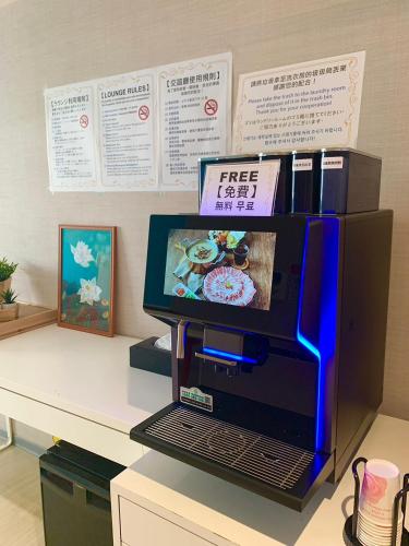a computer monitor on top of a desk at HATAGO+ THE ALLEY in Taipei