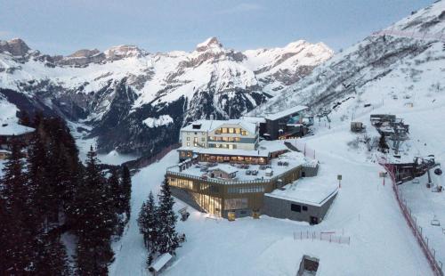 a building on top of a snow covered mountain at Berghotel Trübsee - Accessible Only by Cable Car in Engelberg