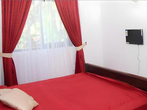 Cama o camas de una habitación en The MGS Hotel