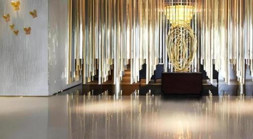 a large room with a chandelier in the middle of it at Dusit D2 Binhu Changzhou Hotel in Changzhou