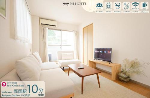 a living room with a white couch and a tv at Mi-APT MIDORI in Tokyo