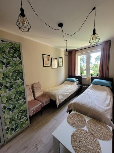 Postel nebo postele na pokoji v ubytování Apartament MILANO Chojnice