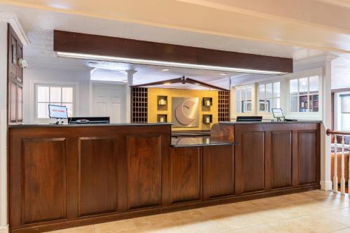 a kitchen with a large wooden counter top at Comfort Inn Rockland - Boston in Rockland