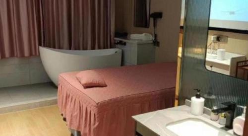 Ein Bett oder Betten in einem Zimmer der Unterkunft Yiwu Bairui Grand Hotel
