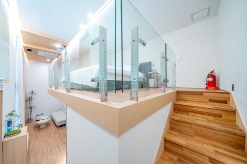 a room with a glass display in a building at Ocean Bliss in Ulsan