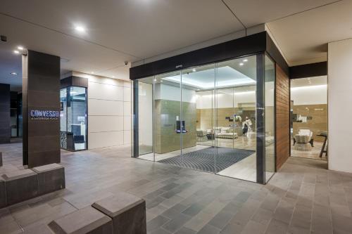 a lobby of a building with glass doors at Opulent Harbourside Sanctuary in Melbourne
