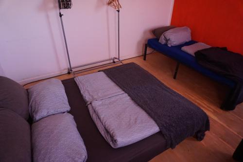 a living room with a bed and a couch at Schönes Loft über den Dächern in Stadt Schenefeld