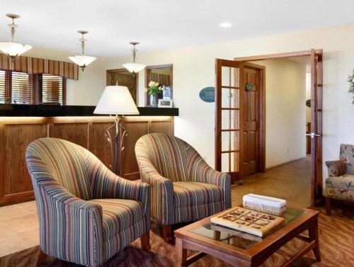 a living room with two chairs and a table at Quality Inn & Suites Detroit Lakes in Detroit Lakes