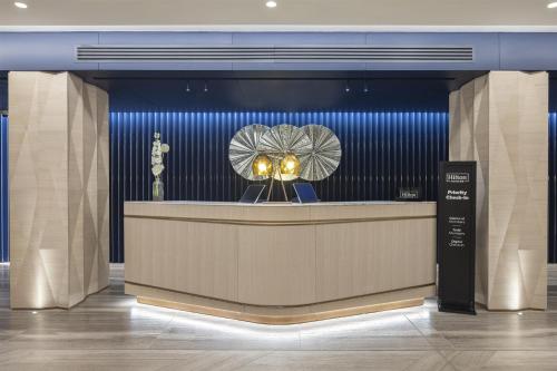 a lobby with a museum with a statue of a fan at Hilton Istanbul Bosphorus in Istanbul