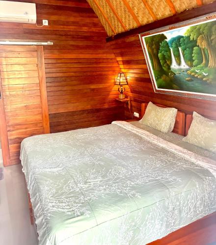 Ένα ή περισσότερα κρεβάτια σε δωμάτιο στο Putra Bali Villa by Antara