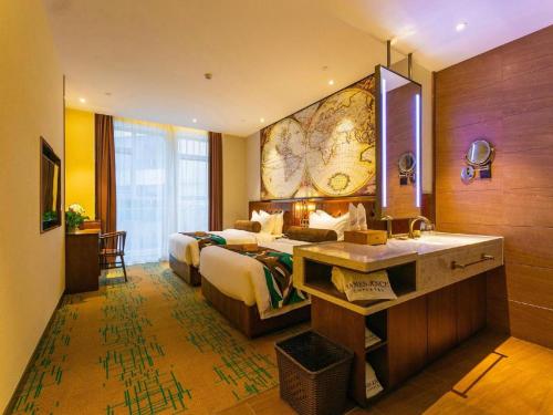 a hotel room with a bed and a sink at James Joyce Coffetel Chengdou Wuqing Wanda Plaza in Chengdu
