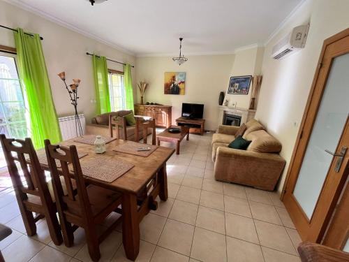 a living room with a table and a couch at Rockfield 4 in Albufeira