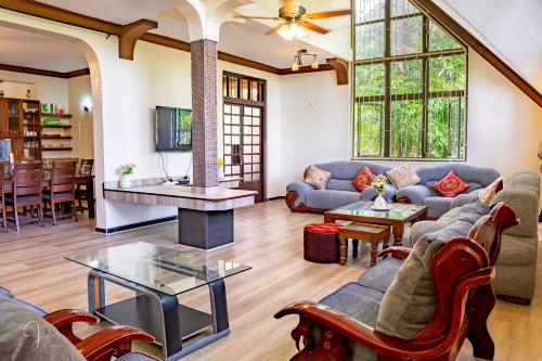 a living room with a couch and a table at Mtwapa Curtie Home in Mombasa