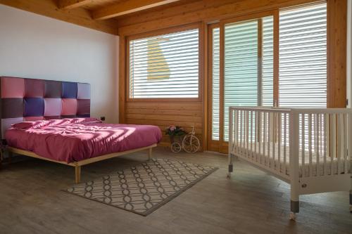 Postel nebo postele na pokoji v ubytování Agriturismo Alveare sul lago